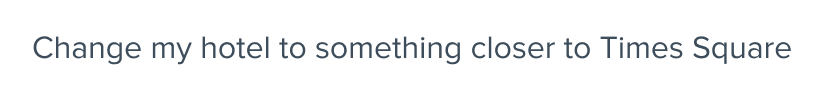 User message input “Change my hotel to something closer to Times Square.”